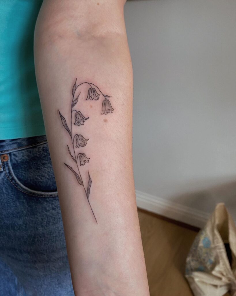 Bluebell wild flower tattoo on the forearm nature's elegance