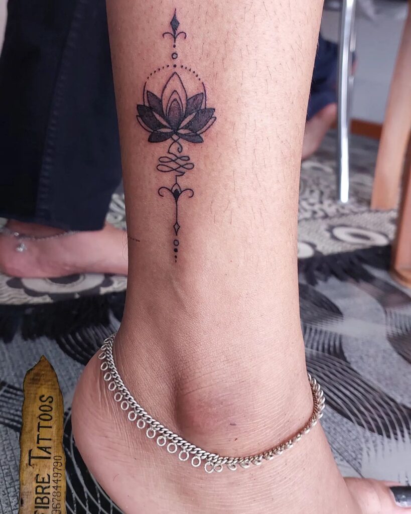 Bohemian tattoo design for women on leg with image