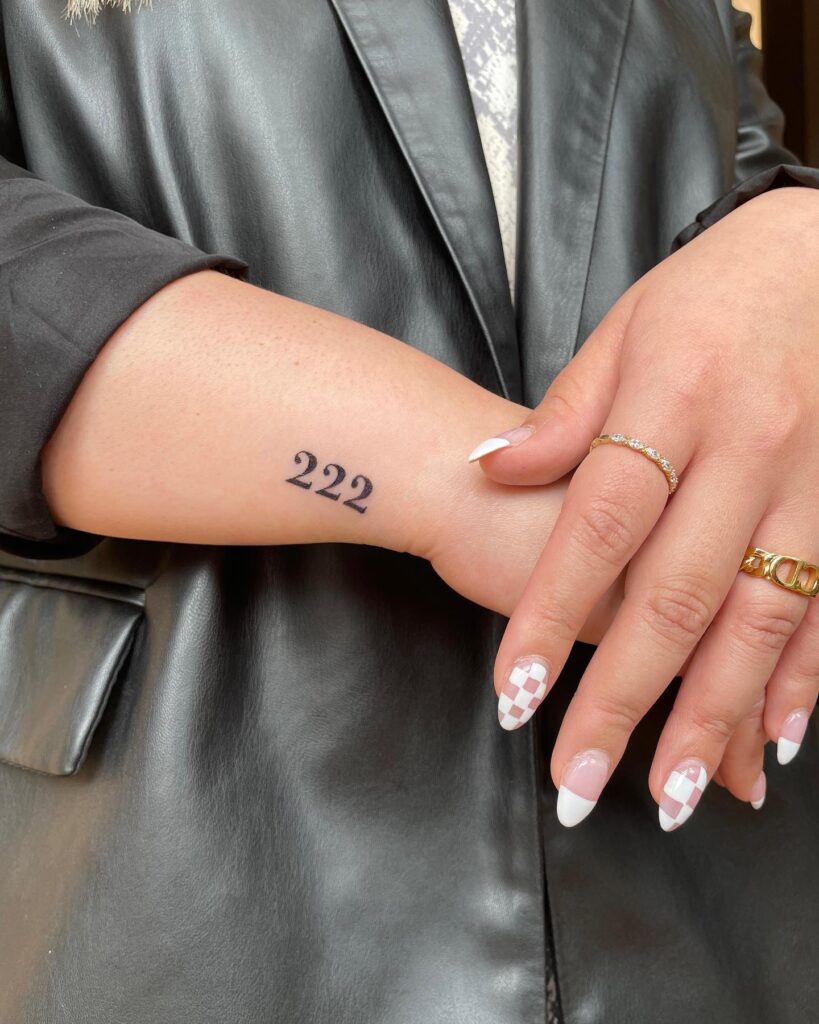 Bold '222' Tattoo on the Side Wrist, a Confident Expression: Bold Statement 