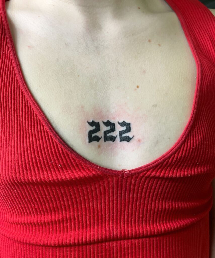 Bold 222 Upper Breast Tattoos for Females: Feminine Strength, a Statement of Confidence 