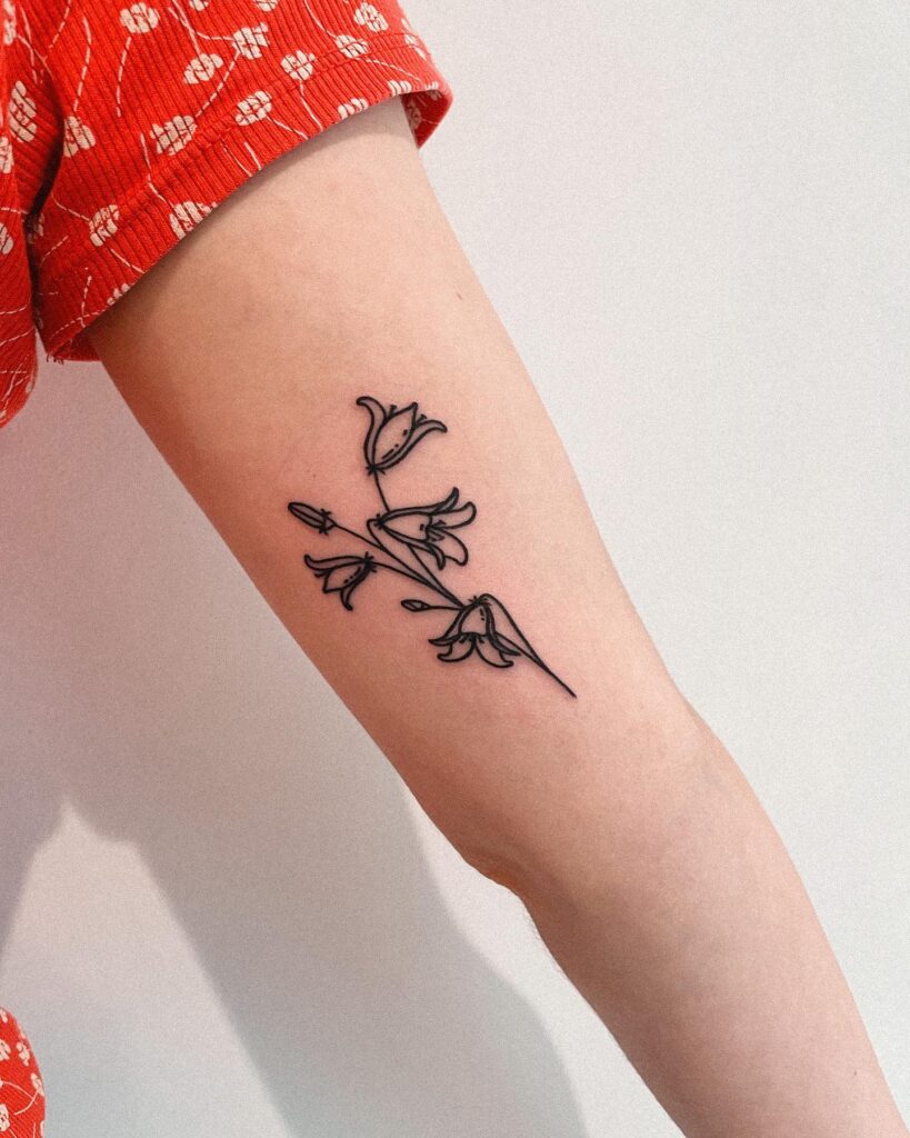 Bold and Striking Bluebell Flower Upper Arm Tattoo for Girls