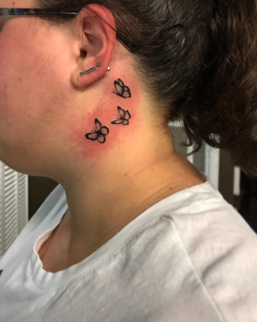 Bold trio three butterflies on ear and neck