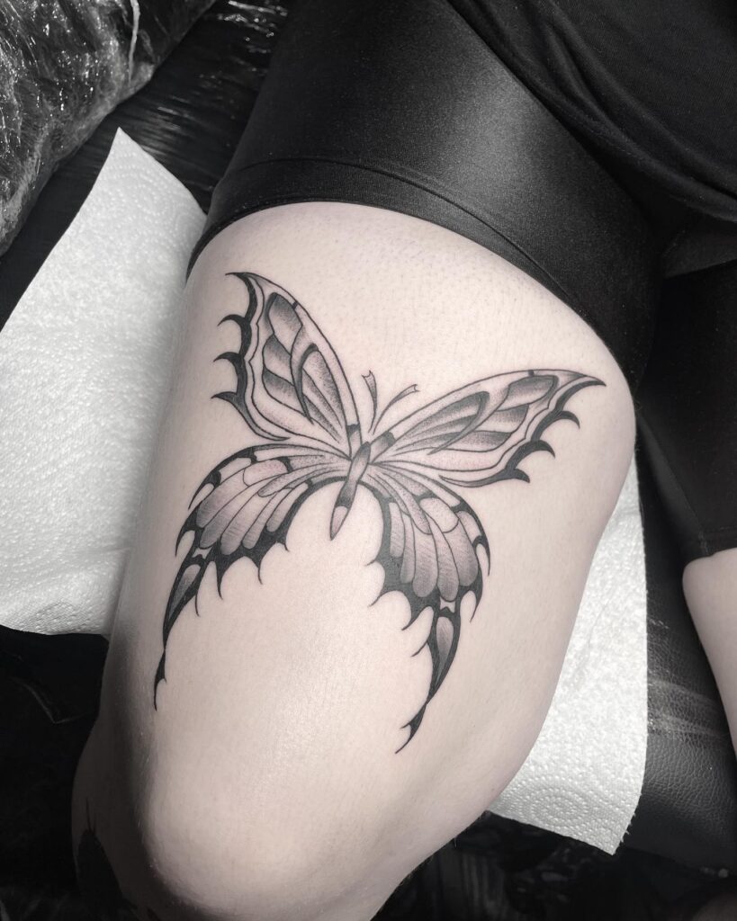 Bold & unique big butterfly tattoo design on thigh for women