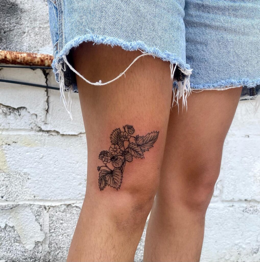 Botanical strawberry plant above the knee tattoo for girls fruity freshness