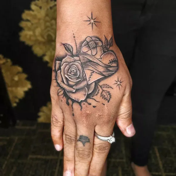 Broken heart tattoo on hand