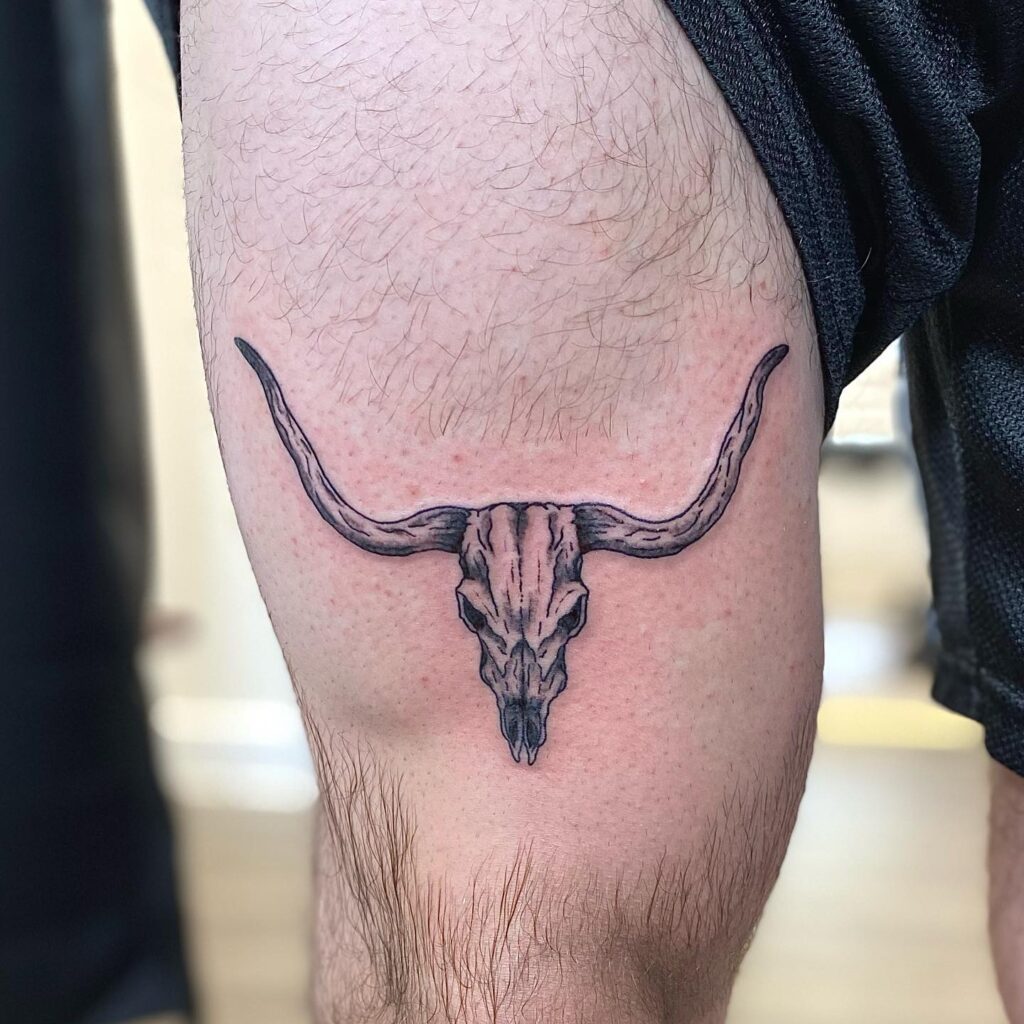 Bull Skull Tattoo Above the Knee: Design Ideas for Men