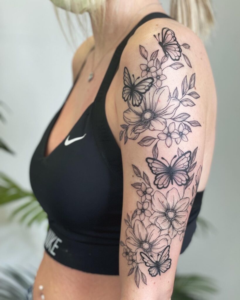 Butterflies and florals female half sleeve: graceful insects amidst blooming gardens