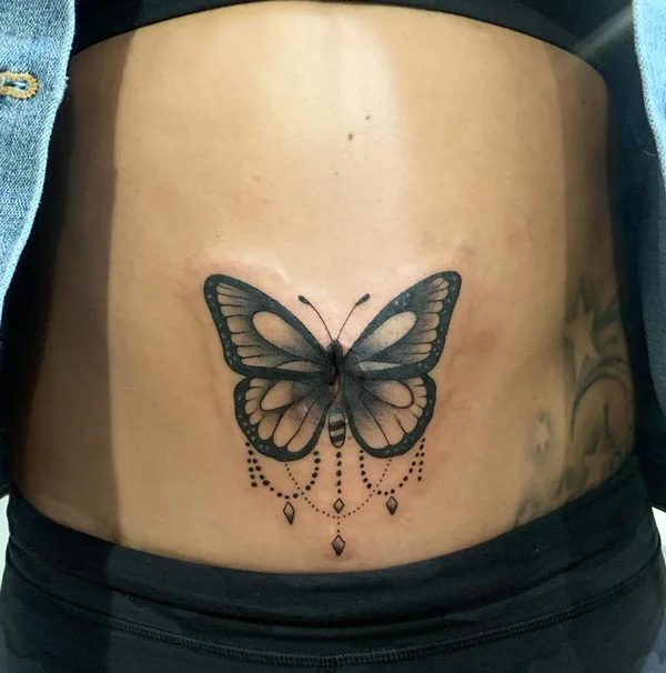 Butterfly belly button tattoo