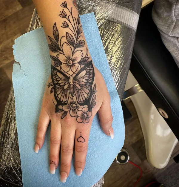 Butterfly hand tattoo 1