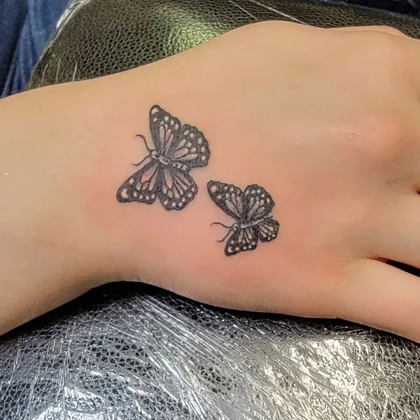 Butterfly hand tattoo 12