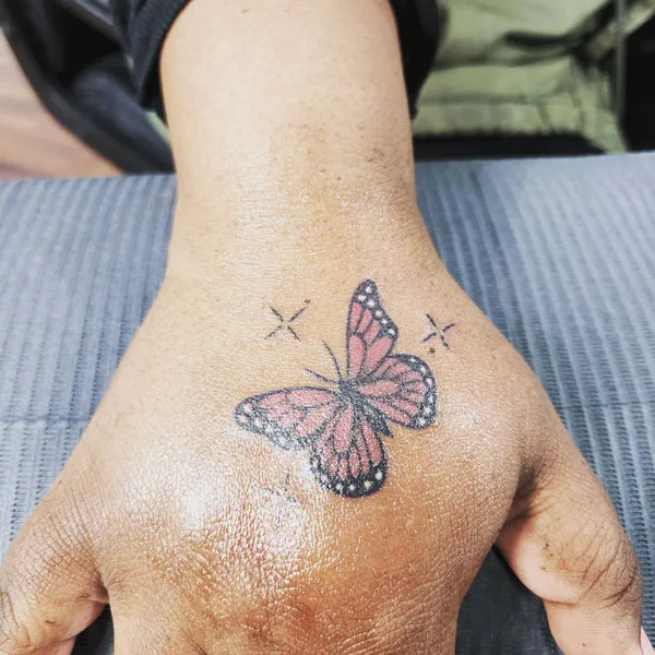 Butterfly hand tattoo 13