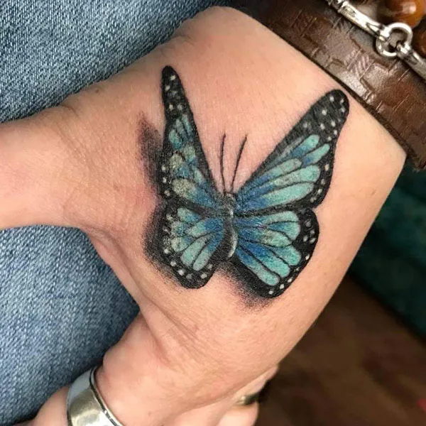 Butterfly hand tattoo 15