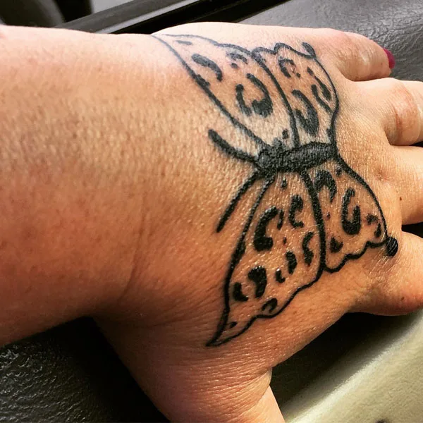 Butterfly hand tattoo 16