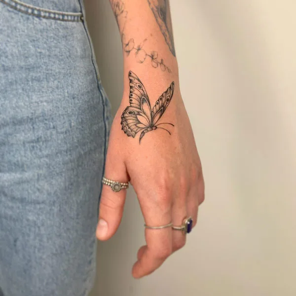 Butterfly hand tattoo 17
