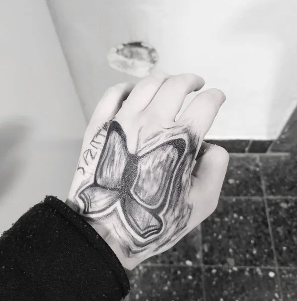 Butterfly hand tattoo 19