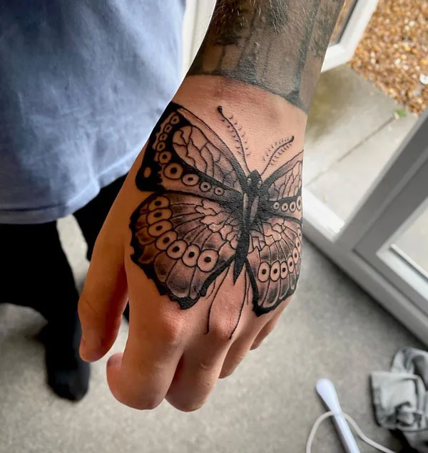 Butterfly hand tattoo 22