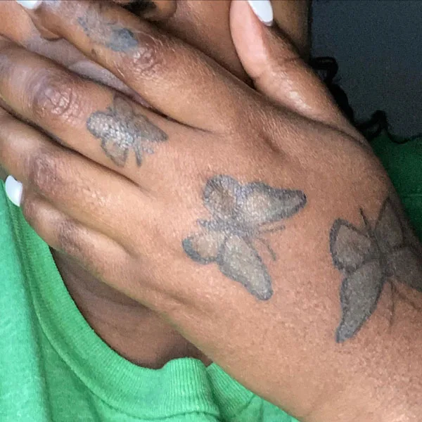Butterfly hand tattoo 25