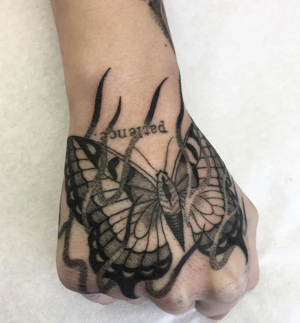 Butterfly hand tattoo 26