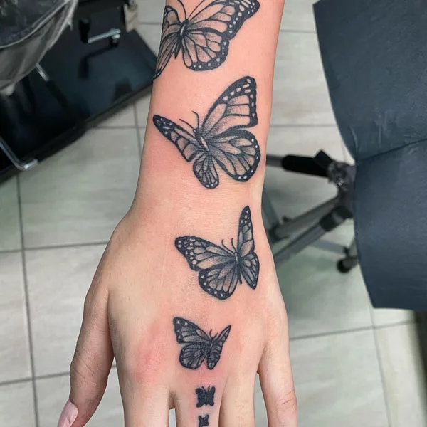 Butterfly hand tattoo 30