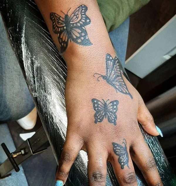 Butterfly hand tattoo 31