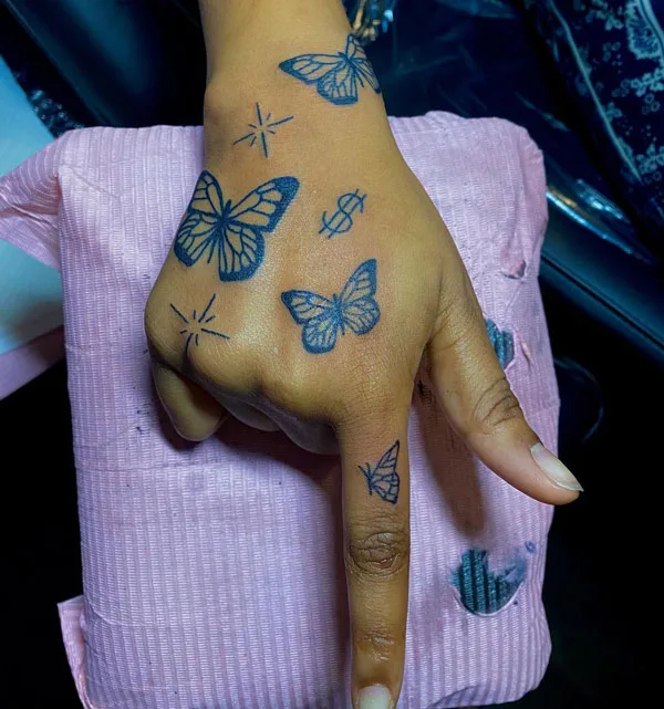 Butterfly hand tattoo 33