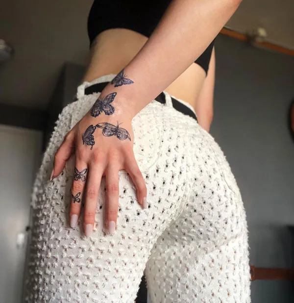 Butterfly hand tattoo 37