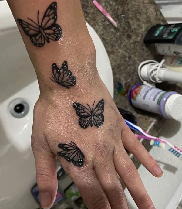 Butterfly hand tattoo 38