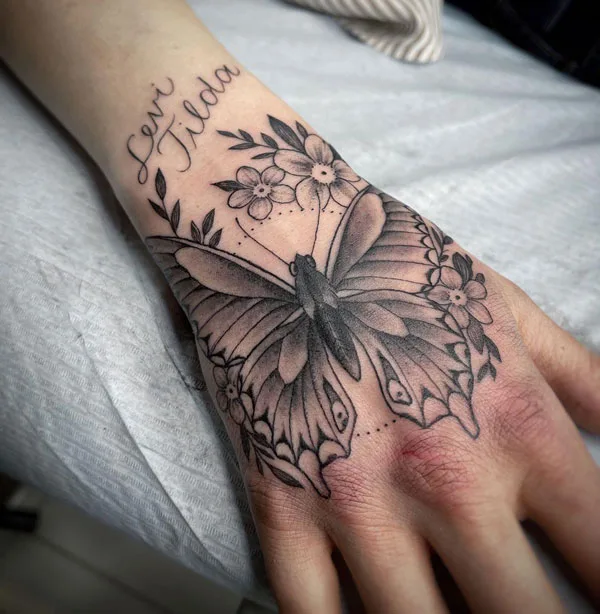 Butterfly hand tattoo 44