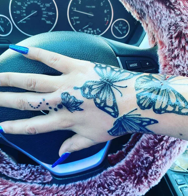 Butterfly hand tattoo 46