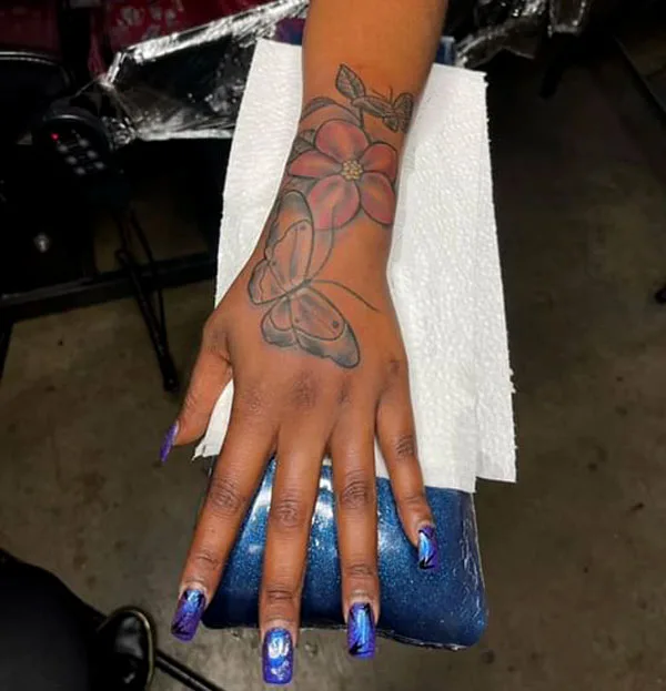 Butterfly hand tattoo 58