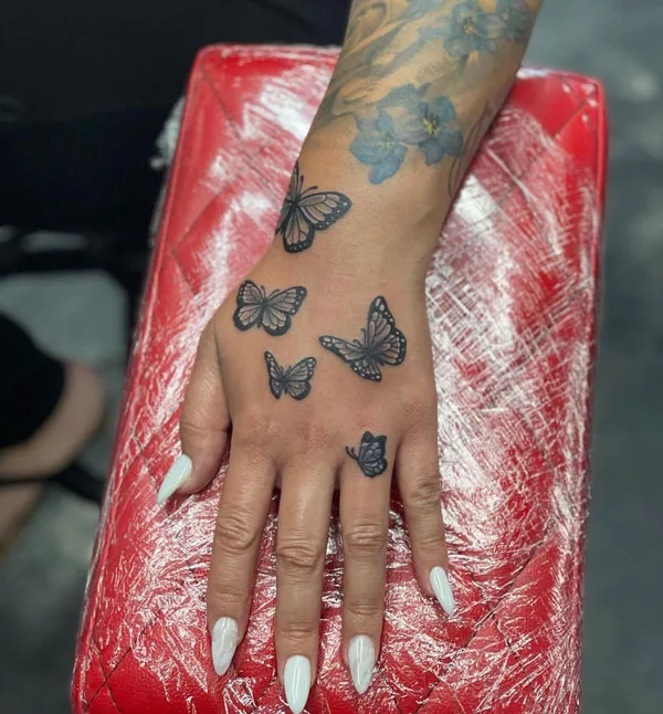 Butterfly hand tattoo 64