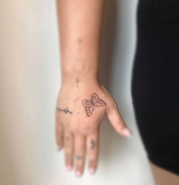 Butterfly hand tattoo 65
