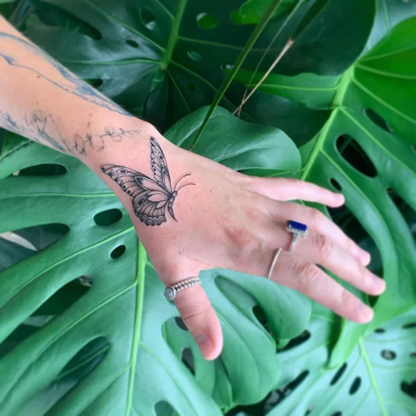 Butterfly hand tattoo 68