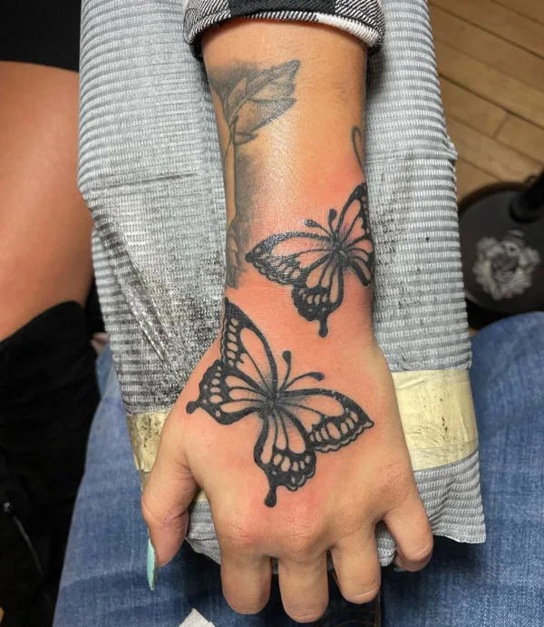 Butterfly hand tattoo 8
