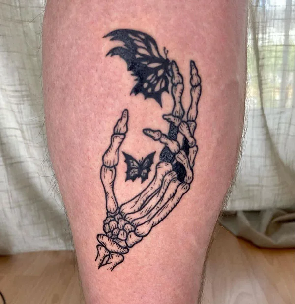Butterfly skeleton hand tattoo