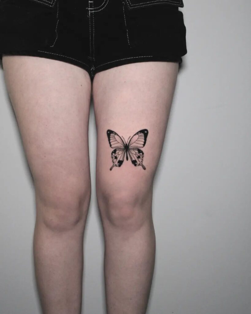 Butterfly tattoo above the knee unique placement