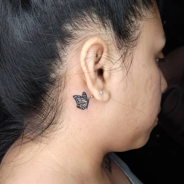 Butterfly tattoo behind ear 40