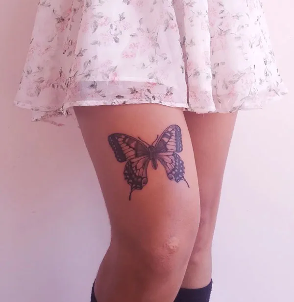 Butterfly thigh tattoo 10