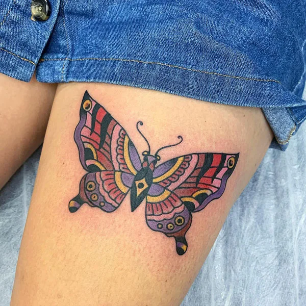 Butterfly thigh tattoo 13