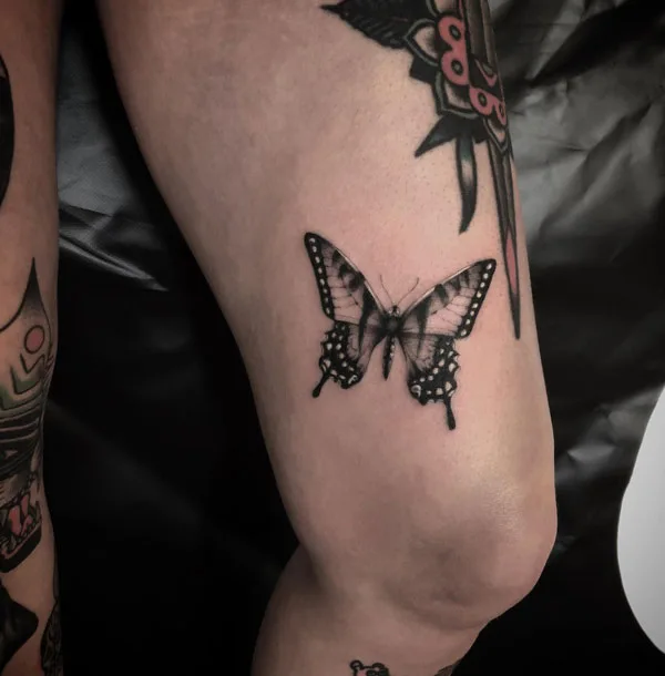 Butterfly thigh tattoo 14