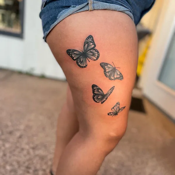 Butterfly thigh tattoo 23