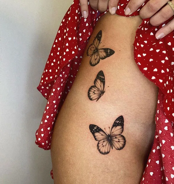 Butterfly thigh tattoo 30