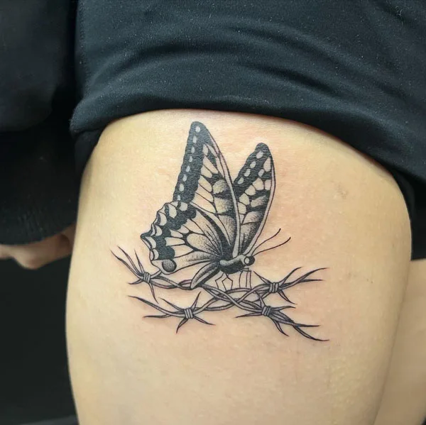 Butterfly thigh tattoo 35
