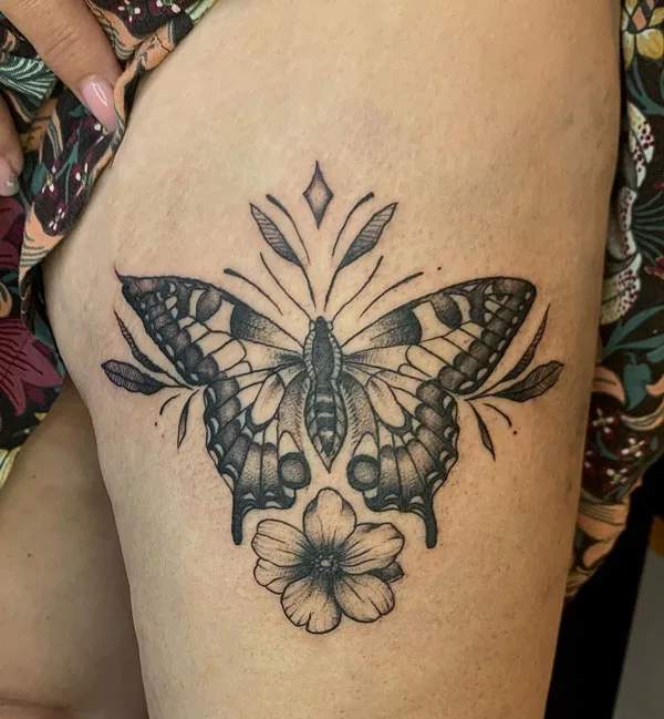 Butterfly thigh tattoo 43