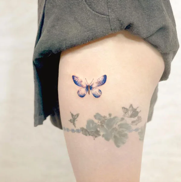 Butterfly thigh tattoo 5