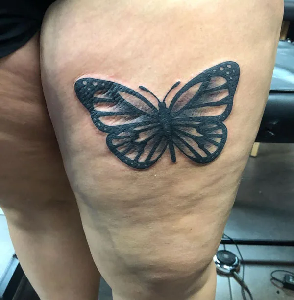 Butterfly thigh tattoo 52