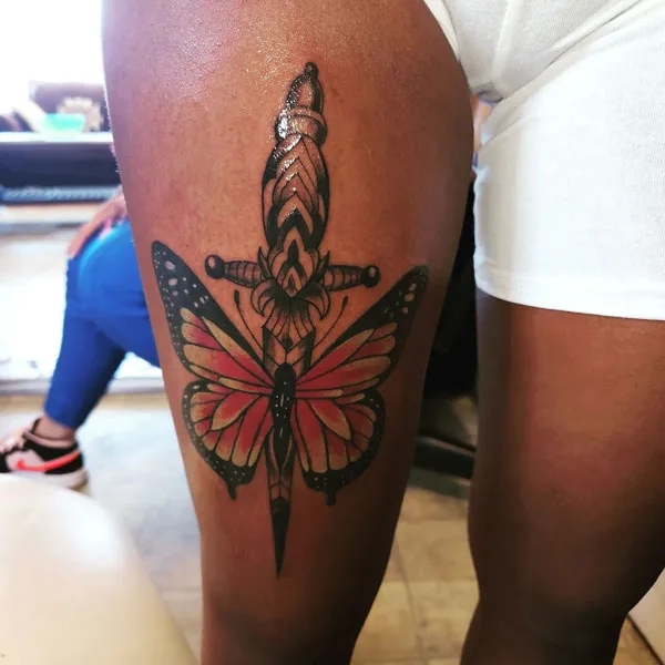 Butterfly thigh tattoo 76