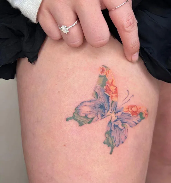 Butterfly thigh tattoo 81