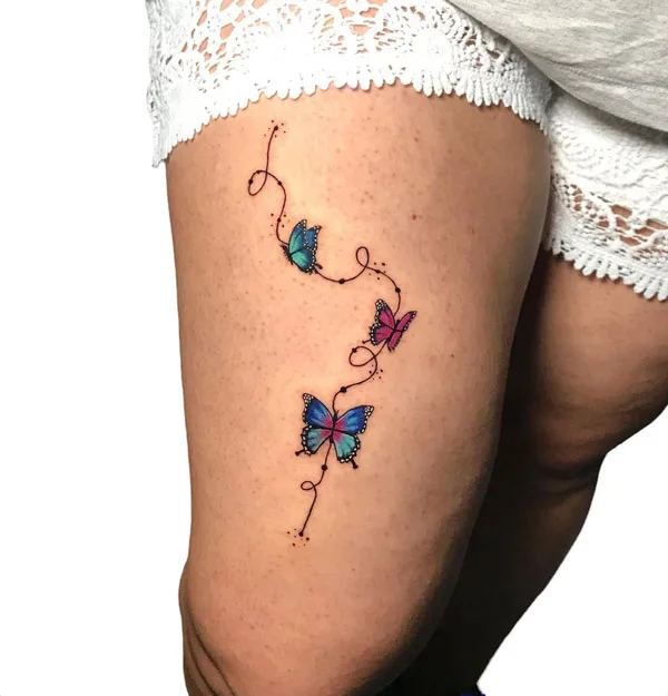 Butterfly thigh tattoo 9