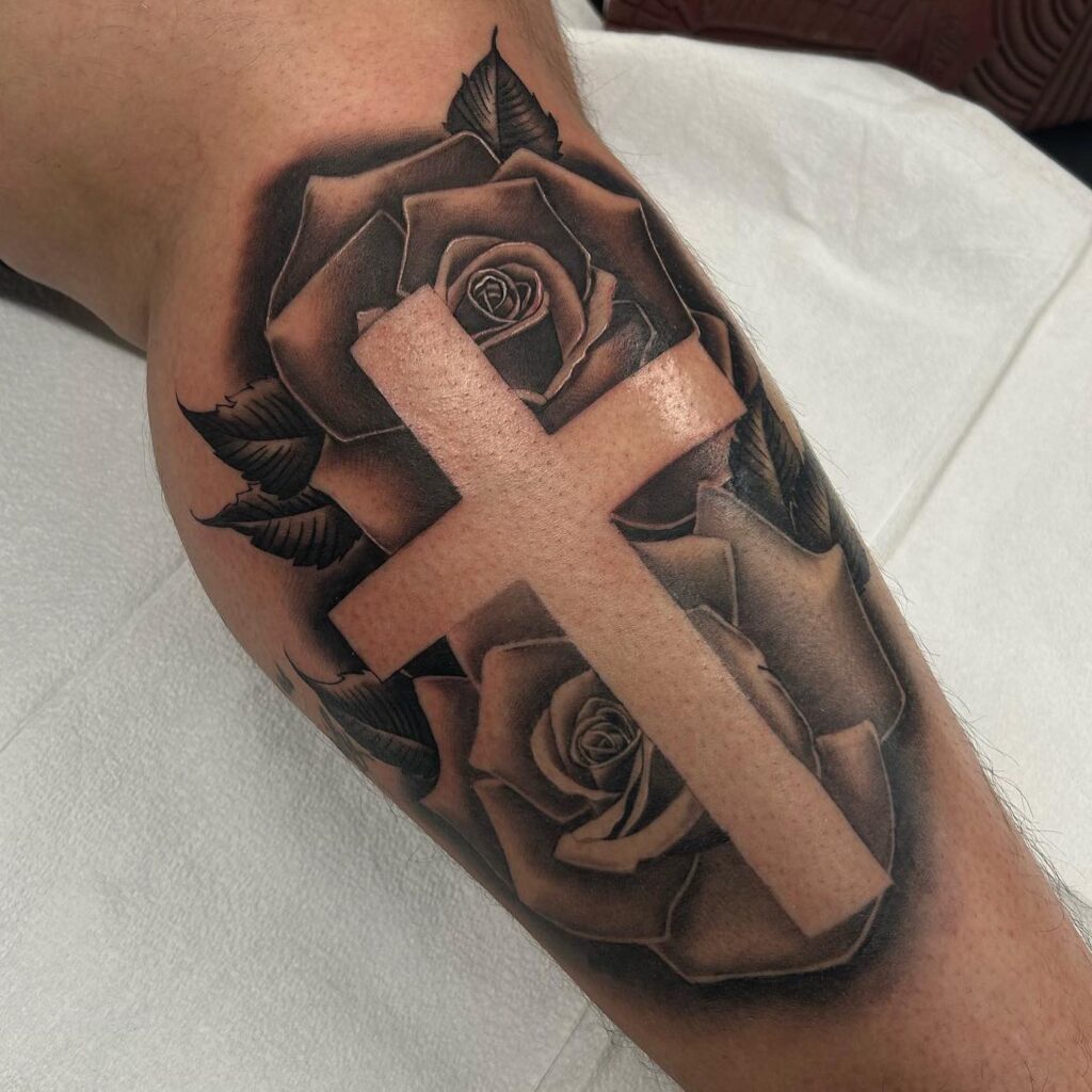 Calf tattoo cross with rose for men bold and artistic
